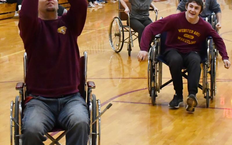 As part of FFA week celebrations at Webster Area High School, the traditon of a teacher vs student wheelchair basketball game took place Feb. 21. Here from left, Nathan Bloom attempts to shoot a basketball while Christina Norton, Rylan Meuer and Jesse Williams trail behind. Reporter &amp;amp; Farmer | Brenner Cariveau