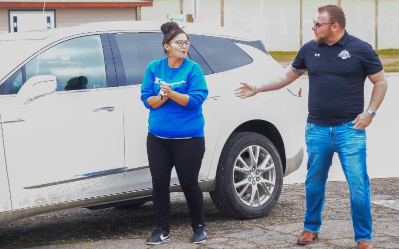 Jaynie Barse holds a set of keys to a new-to-her 2023 Buick Enclave, which she was gifted from Northland Auto Nov. 1. Northland Auto Vice President Nick Johnson, pictured at right, made the presentation to the Webster mother of seven. Reporter &amp;amp; Farmer | Connor Handrahan