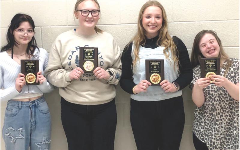 Bearcat basketball cheerleading awards were presented to, from left, Aubriella Cyrus, captain; Rylee Mortenson, most valuable cheerleader; Brylie Reeves, captain award and Jaelyn Rithmiller, most spirited cheerleader. Reporter &amp;amp; Farmer \\ Subscriber snapshot