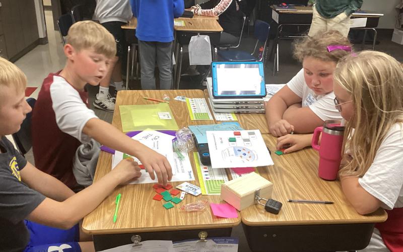 Fifth Grade students seen here Jaxson Hansen, Kru Johnson, Kinsley Ash, and Reagan Fish are working to crack the mathematical code for one of the six escape room challenges. Reporter &amp;amp; Farmer | Subscriber Snapshot