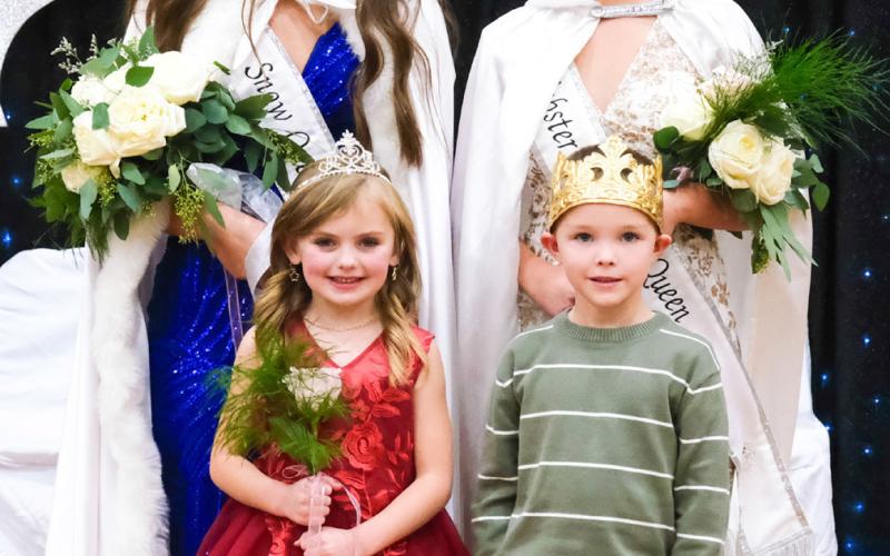 Representing Webster at the upcoming South Dakota Snow Queen Festival in Aberdeen will be, from left, Josie Spiering, 2026 Webster Snow Queen and Remi Hubsch, 2026 Webster Junior Snow Queen. The two were crowned during Webster Snow Queen coronations in the Webster Area High School gymnasium Nov. 22. Also pictured in front, from left, are Webster Snow Princess Blakely Hanson and Webster Snow Prince Grayson Kuecker. Reporter &amp;amp; Farmer | Leyton Beardslee