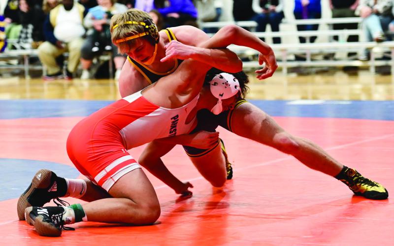 Webster Area boys wrestlers competed at the Little B Tournament in Parkston Jan. 25. Here, Bearcat wrestler Gage Baumgarn attempts to grapple Parkston’s John Weber in the quarterfinal match of the 165 pound weight class. Reporter &amp;amp; Farmer | Dax Jorgenson