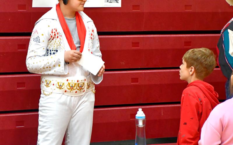 Grant Hauck gives his best Elvis impression as part of a wax museum event by Webster Area Elementary students at the Webster Armory May 2. Students dressed up as historical figures and gave presentations on their significance to those who attended. Reporter &amp;amp; Farmer | Leyton Beardslee