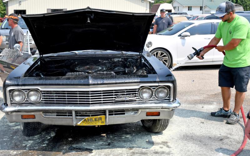 Classic car catches fire after parade