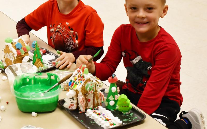 Missy Hortness’ first grade class spent time making gingerbread houses Dec. 12. Here from left, Camdyn Huffman and Lawson VanderLinden sit next to their gingerbread houses. Reporter &amp;amp; Farmer | Brenner Cariveau