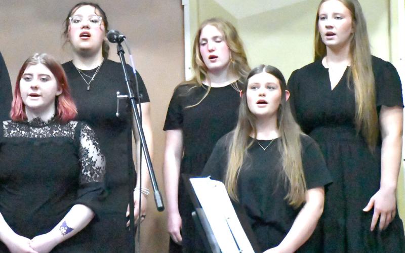 From back row left, Izzy Ladue, Rylan Huggett, Callie Shoemaker; from front row left, Shantel Holzerland and Tenley Spiering join other students in singing during the Webster Area music concert May 4. Reporter &amp;amp; Farmer | Connor Handrahan