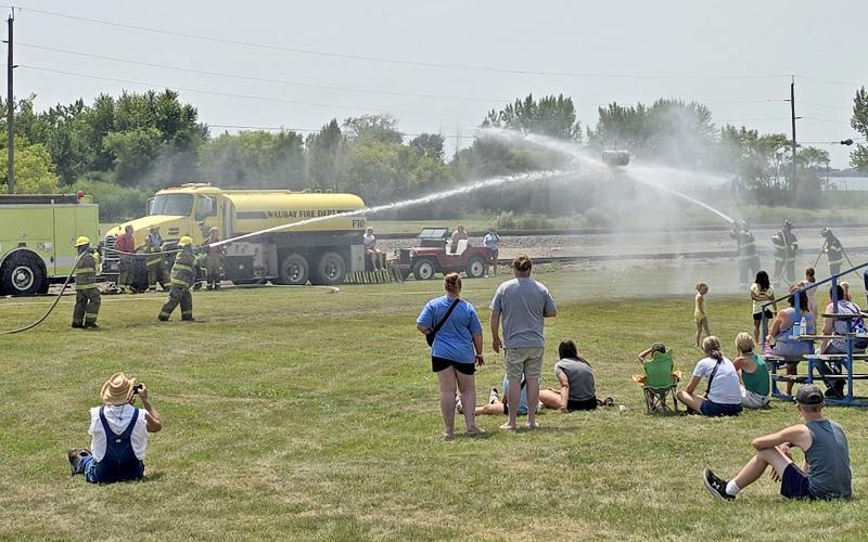 Summit Fire Department was the winner of the annual Fireman’s Water Fight in Waubay last weekend during the Waubay Fun Fest activities. Pictured, a crowd watches as a Summit team goes up against a team from the Waubay Fire Department. Reporter &amp;amp; Farmer | Subscriber snapshot