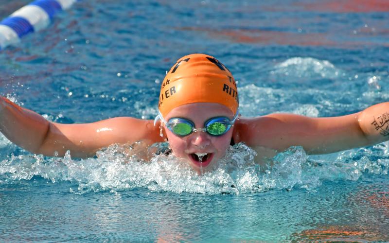 Webster Tigerfish Hadley Rithmiller throws her arms forward to propel herself through the water July 9 during the Webster 12 and Under Fun Meet. Reporter &amp;amp; Farmer | Amanda Dulitz