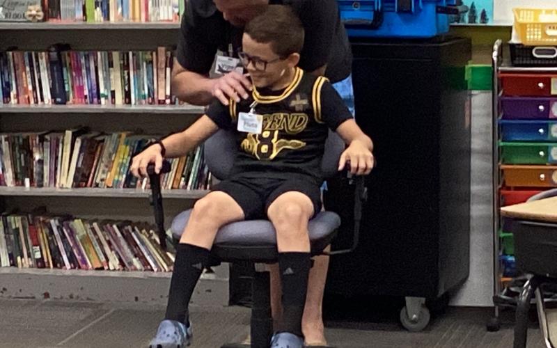 Tucker Aadland, student at Webster Area School and STARBASE instructor “Viper,” Jesse Rounds demonstrating Newton’s second Law of Motion during the STARBASE class time experiment. Reporter &amp;amp; Farmer | Subscriber Snapshot