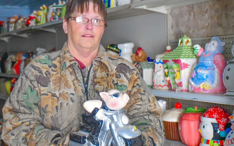 Patti Mitchell holds one of her approximately 6,000 cookie jars in her future museum in Roslyn Dec. 6. Mitchell said she has been collecting for 30 years is hopeful the museum will open to the public in May 2026. Reporter &amp;amp; Farmer | Leyton Beardslee