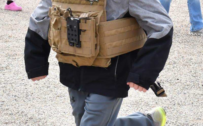 Waubay student Harlan Olson participates in the safety training held at Day County Fairgrounds May 6. Olson put on a South Dakota Highway Patrol officer’s vest and tries to run in it. Reporter &amp;amp; Farmer | Connor Handrahan