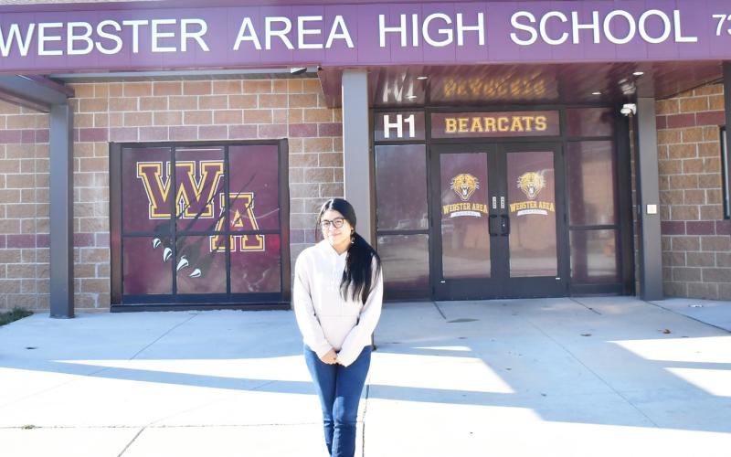 Webster Area High School foreign exchance student Azucena Murrillo from Madrid, Spain, stands in front of the Webster Area High School entrance Nov. 5. Reporter &amp;amp; Farmer | Brenner Cariveau