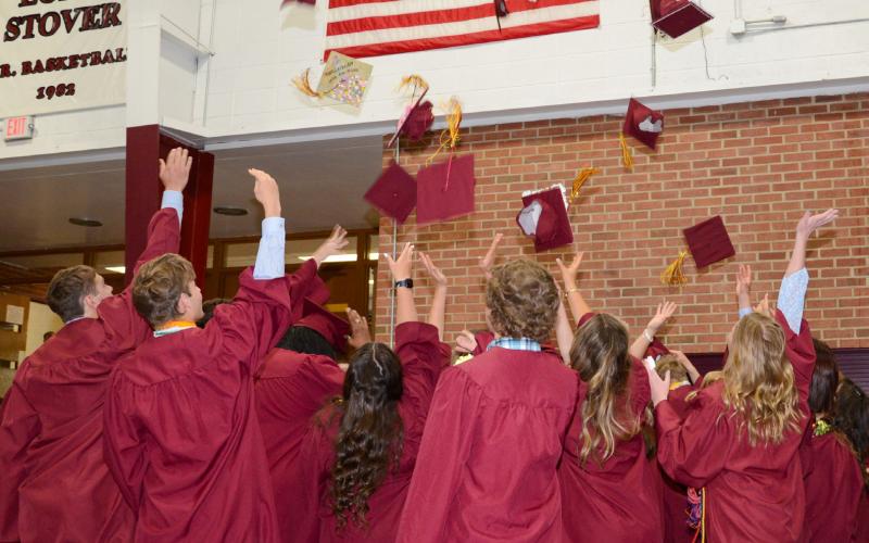 Webster Area High School graduates toss their graduation caps in the air following their graduation ceremony proceedings at the Webster Armory May 19. Thirty-two individuals crossed the stage to receive their diplomas that day. Reporter &amp;amp; Farmer | Amanda Dulitz