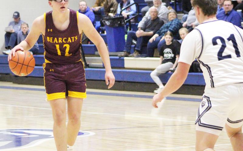 Webster Area Bearcats faced off against Great Plains Lutheran Panthers in an away game Feb. 4 which resulted in a 45-59 Bearcats loss. Here, Jeron McCreary (12) approaches the top of the key while Panthers defender Austin Rubendall (21) prepares to get into position. Reporter &amp;amp; Farmer | Subscriber Snapshot