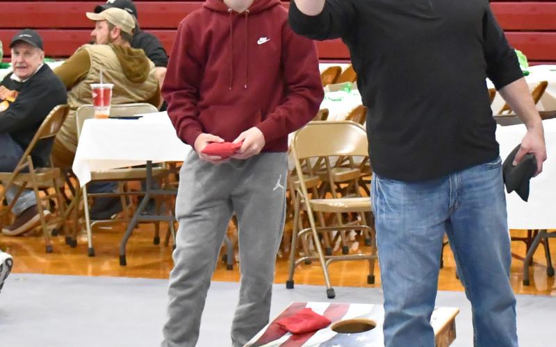 The annual Shake your Shamrock event in Webster was held on the rescheduled date April 25. Here, Maverick Coester and Morgan Dorsett battle back and forth for the first points of the finals in a cornhole tournament at the event. Dorsett and his partner Martin Dorsett ended up taking first place at the event. Other activities were held throughout the day. Reporter &amp;amp; Farmer | Connor Handrahan