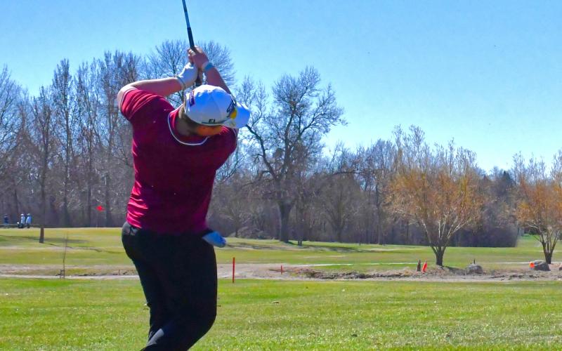 Zayden Finch of Wesbter Area tees off on a par three, having a nice shot and landing on the outside of the green during the Webster Area Invitational April 21. Reporter &amp;amp; Farmer | Connor Handrahan