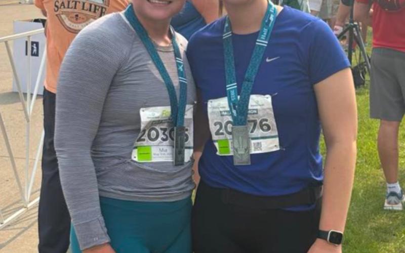 Reporter &amp;amp; Farmer | Leyton Beardslee (Above) Among the half marathon runners are from left Jenna Sinner, Madison Rausch, Jennifer Nelson and Missy Rausch. The 13.1 mile race took place May 31 in Fargo, ND and featured seven Webster women who all completed the race. (At right) Half marathon runners from left Mia Coester and Norah Zubke pose with their medals after completing the 13.1 mile race in Fargo, ND May 31. (Subscriber snapshot)