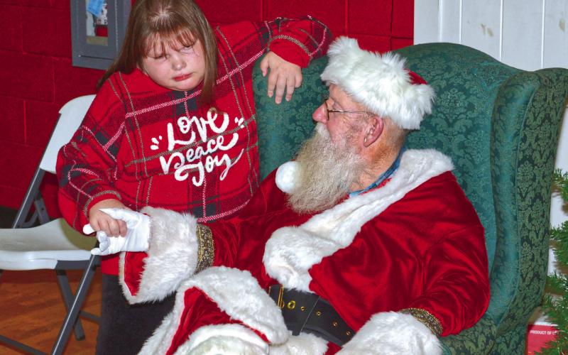 Roslyn Booster Club invited Santa to celebrate Christmas with them for their appreciation day and holiday celebration Dec. 5. Santa brought his Christmas spirit and asked KrisLynn Town what gifts he could bring her on Christmas Eve. Reporter &amp;amp; Farmer | Connor Handrahan