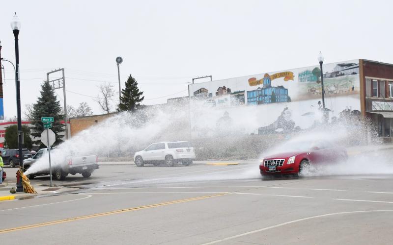 The fire hydrant on the corner of Main St. and W. 6th Ave., Webster was being flushed Nov. 6 while a car passes through the gushing water. Reporter &amp;amp; Farmer | Brenner Cariveau