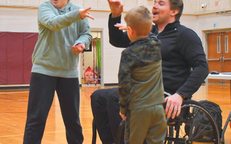 From left, Kenzie Nelson and Lincoln Vander Linden face off in the final round of a rock, paper, scissors tournament during Hunter Pinke’s presentation. Pinke told his story about how he achieved his goals and told students how they can achieve their own dreams. Reporter &amp;amp; Farmer | Connor Handrahan