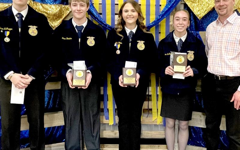 Best record book awards, sponsored by Dacotah Bank, were presented at the Webster/ Waubay FFA banquet by bank president Kelly Hanson, right. Award recipients for each grade, from left, are senior Blaise McGregor, junior Tevin Howder, sophomore Lola Wells and freshman Macee McGregor. Reporter &amp;amp; Farmer | Subscriber snapshot
