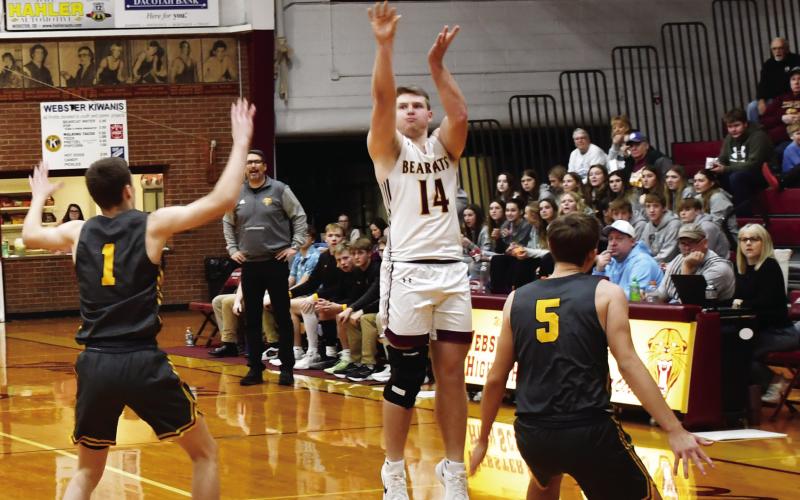 Webster Area Bearcats hosted Groton Area Tigers Dec. 30 in a contest the Bearcats lost 46-76. Here, Matthew Mount (14) attempts a three over Groton Area defenders Keegen Tracy (1) and Becker Busma (5). Reporter &amp;amp; Farmer | Brenner Cariveau