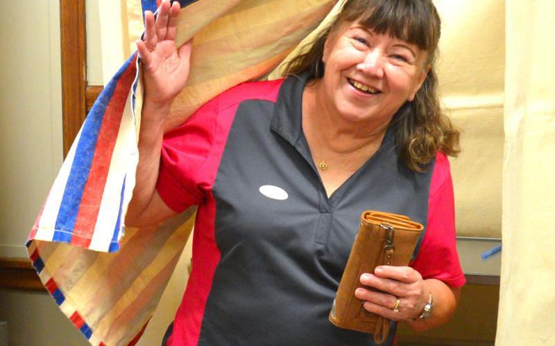 Webster resident Marcia Solberg exits a voting booth after casting her ballot at Webster City Hall on primary election day June 2.