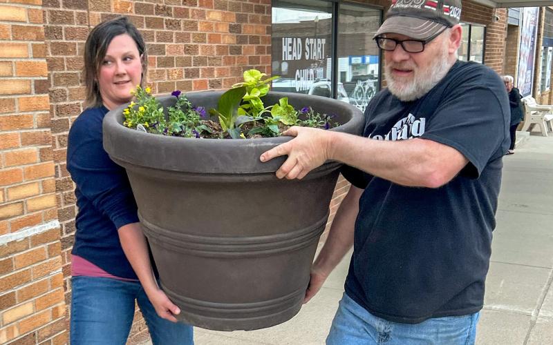 Chelsea Larson and Tim Spiering helped the Webster Area Chamber of Commerce May 23 deliver planters out on Main Street locations prior to the Memorial Day weekend. Reporter &amp;amp; Farmer | Subscriber snapshot