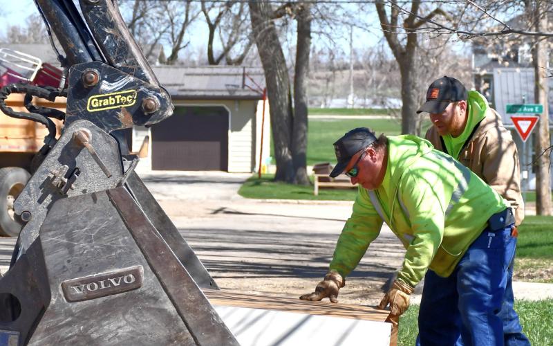 Webster clean up crew workers Danny Kirchmeier and Randy Wolff place trash into the waiting claws of a front-end loader April 29 during the citywide cleanup. This was the first year in a few that the city hosted the event. Reporter &amp;amp; Farmer | Leyton Beardslee