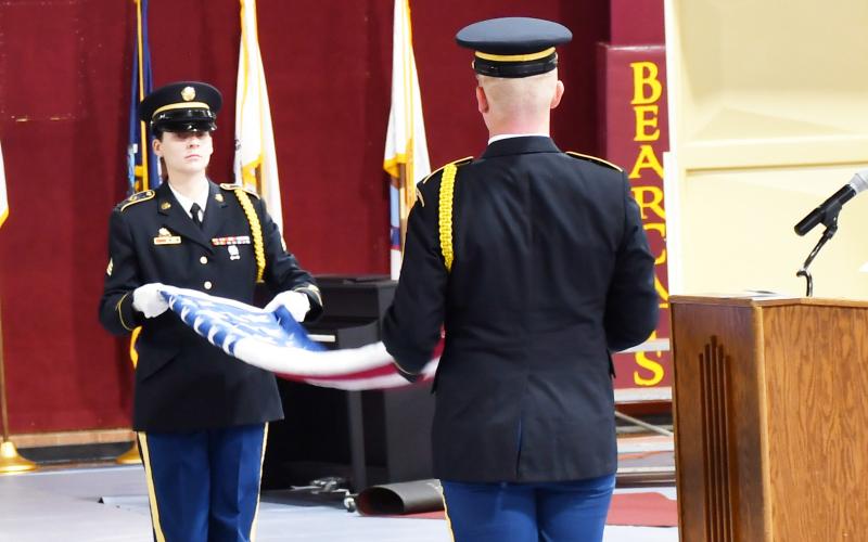 A Veterans Day event was held at the Webster Armory Nov. 9 where members of the South Dakota National Guard performed a funeral honors ceremony. Pictured left is Sergeant Ashley Shultz, who is a funeral honors coordinator aiding in folding the American flag with Staff Sergeant Jaymz Long who is a member of the Watertown National Guard Readiness Center. Reporter &amp;amp; Farmer | Brenner Cariveau