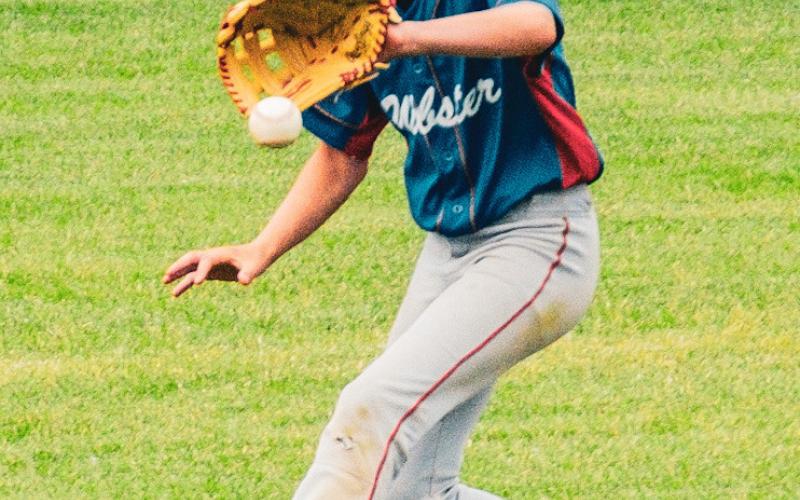 Bennett Kuecker of Webster VFW Post 4690 Teeners snags a ball in left field during Webster’s 1-8 loss against Flandreau July 30 at Bob Wiley Field in Webster. Teeners rebounded the next game of the series with a 24-16 win which sends them to the State Tournament in Volga. Reporter &amp;amp; Farmer | Leyton Beardslee