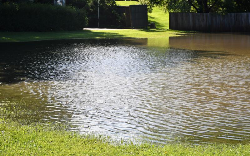 A lot on the corner of W. Eighth Ave. and W. Seventh St. in Webster was flooded after an overnight storm rolled through Aug. 14, bringing an estimated 3.5 inches in Webster. Reporter &amp;amp; Farmer | Leyton Beardslee