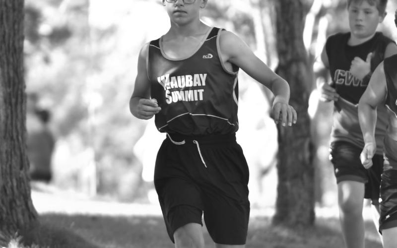 Carsyn Grebner of Waubay/Summit cross country runs the junior varsity 3k race at the Webster Area Invite on the Webster golf course Sept. 15. Grebner finished in 19th with a time of 17:04.54. Reporter &amp;amp; Farmer | Leyton Beardslee