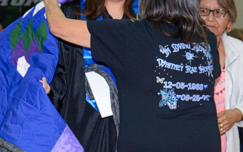 Waubay High School graduate Adryan Hopkins was presented with a quilt by grandmothers Estelle Hopkins and Beatrice Biddell after she received her diploma May 11. Reporter &amp;amp; Farmer | Amanda Dulitz