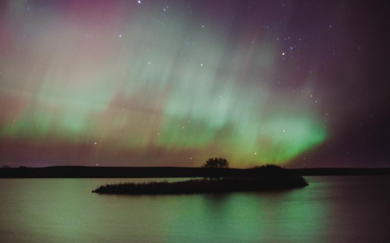 Aurora borealis lights shimmer in the sky north of Webster Nov. 11 along SD Hwy. 25, over a body of water. Reporter &amp;amp; Farmer | Leyton Beardslee