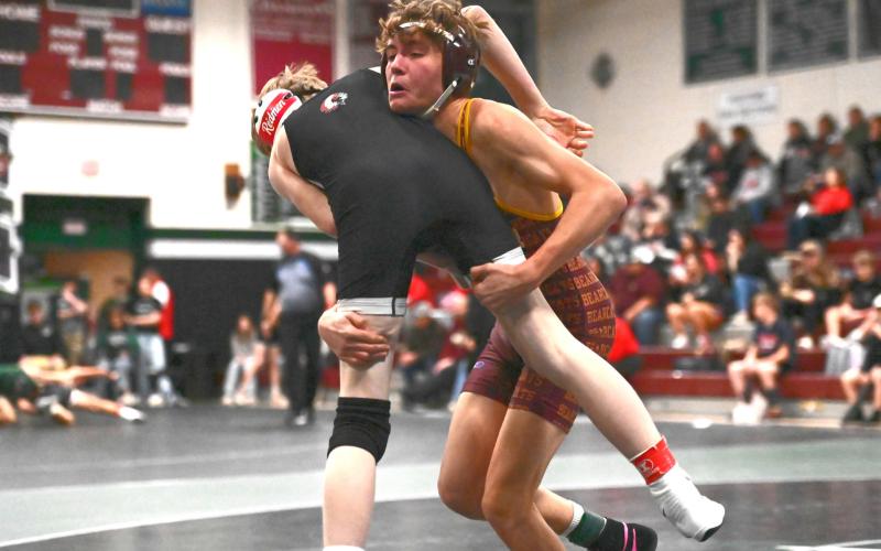 Tayten Kurkowski lifts up his opponent during a match at the Northeast Conference Tournament Dec. 19 in Clark. Kurkowski placed second in the 126 weight class with a record of 1-1. Reporter &amp;amp; Farmer | Brianna Jorgenson, Captured Creations Photography