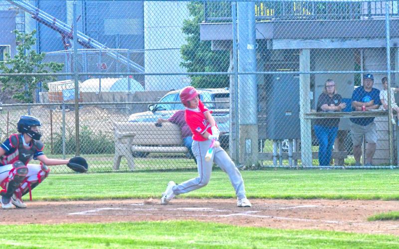 Bennett Kuecker hits a single during Webster Teeners’ first game against Lake Norden June 5. Kuecker was one of 11 runs to be scored in the first inning, which eventually led to a 16-6 victory. Reporter &amp;amp; Farmer | Connor Handrahan
