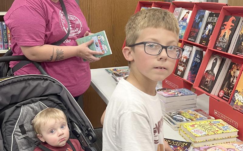 Webster Area School held a bookfair Oct. 7-10 along with parent/teacher conferences. The event helps raise money for the school’s libraries. Rachel Rolstad with Charlie Rolstad and Brayden Town enjoy looking through the selections. Reporter &amp;amp; Farmer | Subscriber snapshot