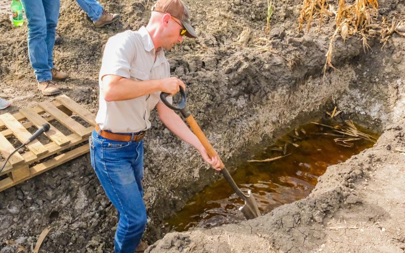 South Dakota state soil health specialist Kent Vlieger shows the water table and salinity level of the soil in a field south of Andover Sept. 29. The area falls in the James River Valley region which since the 1990s has seen an increase in saline affected soil. Reporter &amp;amp; Farmer | Leyton Beardslee