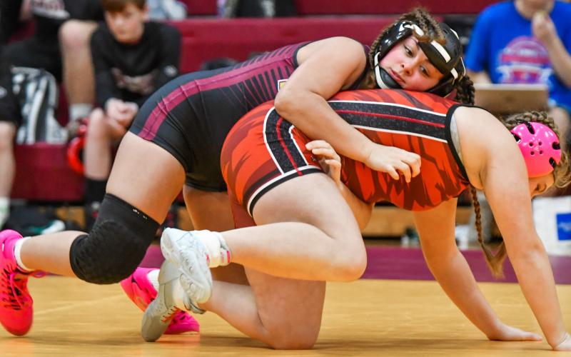 Jocelyn Rumpca of Webster gets a grip on Taylor Brown of Deuel/Deubrook Area during their match in a dual meet held at Webster Armory Jan. 13. Rumpca won the match by fall in 1:10. Reporter &amp;amp; Farmer | Leyton Beardslee