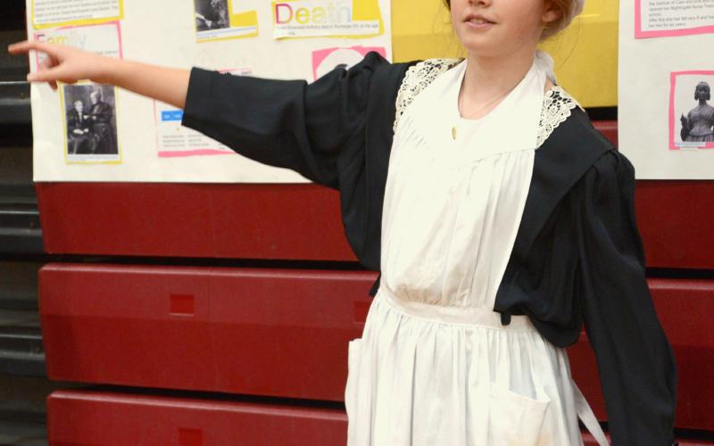 Members of Webster Area Elementary’s fifth grade class put on the annual living wax museum May 3 at Webster Armory. The event was open to the public to watch and listen to students tell about the historical character they had studied and were portraying. Shown here, Arianna Altstadt tells details of the life of Florence Nightingale. Reporter &amp;amp; Farmer | Kole Rithmiller