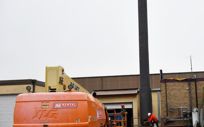 Demolition and dismantling of the Webster Area School boiler, smoke stack and flue started Nov. 5. Here, construction workers clear out debris from the large structure to ensure it is hollow in order to demolish it correctly. Reporter &amp;amp; Farmer | Brenner Cariveau