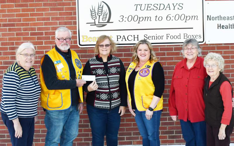 Eden Lions Club donated a check for $500 to the Day County Food Pantry Dec. 3. Pictured from left, Winnie Jacobs Day County Food Pantry volunteer, Dan Poss president of the Eden Lions Club, Margaret Kwasniewski Day County Food Pantry volunteer, Jannine Fagerland secretary of the Eden Lions Club, Mary Wagner and Carol Richardt Day County Food Pantry volunteers, stand in front of the Day County Food Pantry sign. Reporter &amp;amp; Farmer | Brenner Cariveau