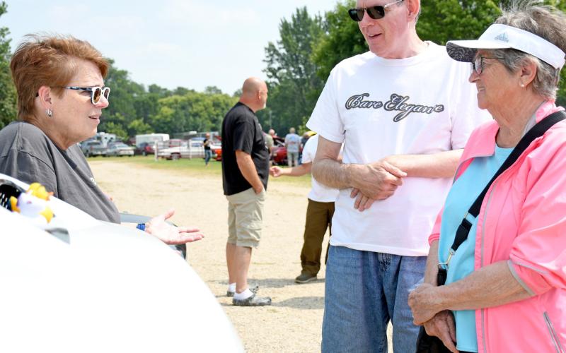 (Above) Christy Brubaker of Aberdeen speaks with Ron Hinze of Arizona and his mother Della Hinze of Webster during the Day County Fair Car Show Aug. 10. Showing her 2020 Jeep Wrangler, Brubaker told passersby the story of the Ducking Kindness movement, which is believed to have started during World War II and is associated with Jeep vehicles. Reporter &amp;amp; Farmer | Amanda Dulitz