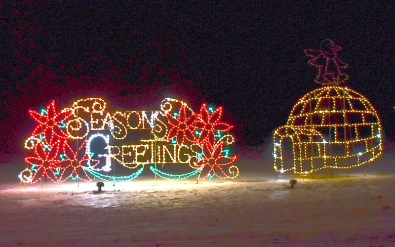 The annual display of holiday lights along Hwy. 12 and the Webster Golf Course are on display. Here, an igloo accompanies the season greetings sign Dec. 11. Reporter &amp;amp; Farmer | Brenner Cariveau