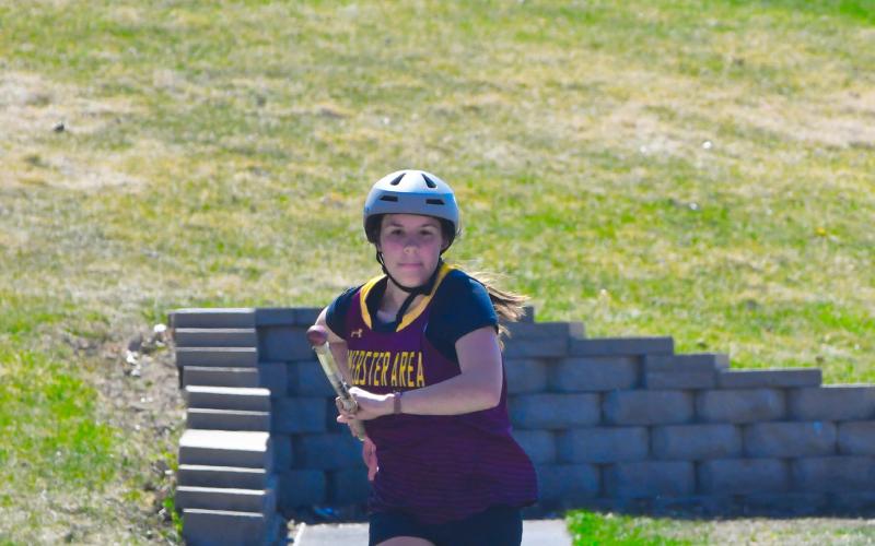 Emily Acree eyes her target midway through an attempt to leap over the bar in Webster April 21. Reporter &amp;amp; Farmer | Leyton Beardslee