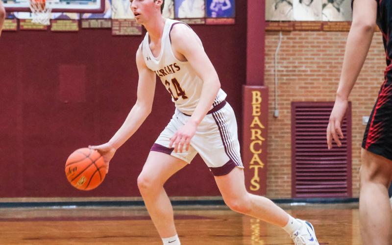 Gage Wik (24) of Webster Area looks for an opening during the Bearcats 59-48 victory against Sisseton Redmen Feb. 9 in Webster. Bearcats move to a record of 9-7 on the season. Reporter &amp;amp; Farmer | Leyton Beardslee