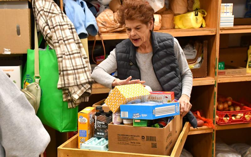 Bristol resident Joni Dolney loads up food for her neighbor at Day County Food Pantry Nov. 11 in Webster. Food pantry organizer Margaret Kwasniewski said the pantry has seen a slight increase in people served due to the government shutdown which resulted in a SNAP block. Reporter &amp;amp; Farmer | Connor Handrahan