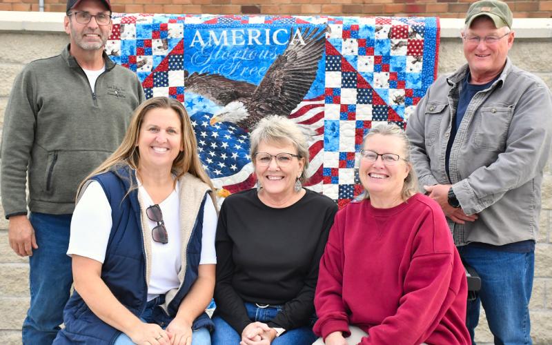 Some of the Roslyn Area Veterans Memorial commitee members pose in the partially completed park Nov. 4. Commitee members are, from back right, Danny Kjos and Terry Corner. Seated, from left, are Jess Simonson, Tamie Sattler and Shelly Deutsch. With a hopeful completion date in 2026 the memorial will contain plaques with names of deceased veterans from the Roslyn area and provide space for community events. Reporter &amp;amp; Farmer | Leyton Beardslee