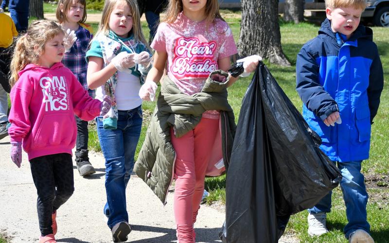 Members of Webster Area Elementary kindergarten class worked their way around town last week to clean up any debris they happened to find. The April 22 activities focused on Earth Day. Pictured from left are, Elyzabeth Gangle, Althea Cyrus (back), Harlow Heupel, Rylee Wik and Caleb Sonstebo. Reporter &amp;amp; Farmer | Amanda Dulitz
